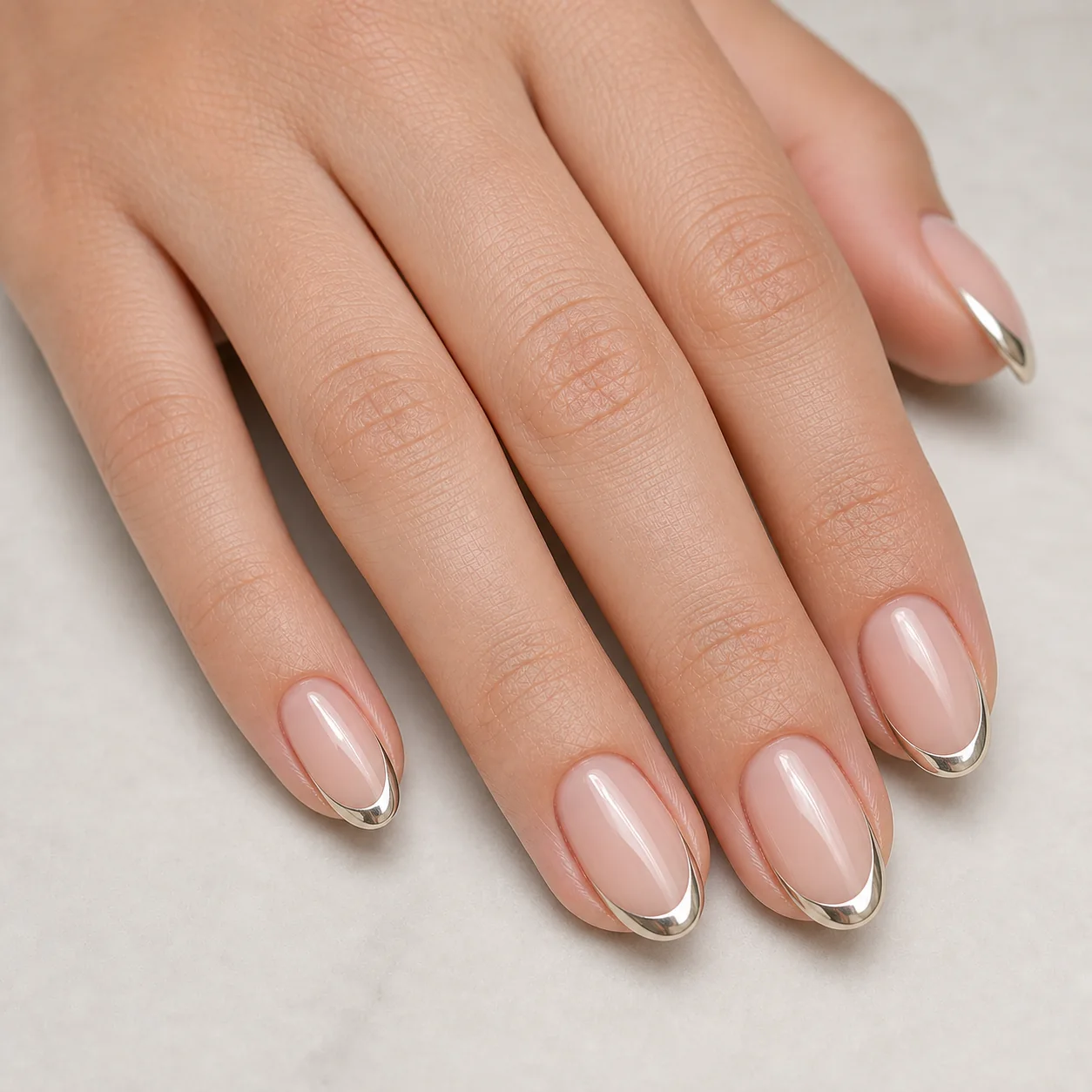 Chrome French tip nails with a metallic pearl edge